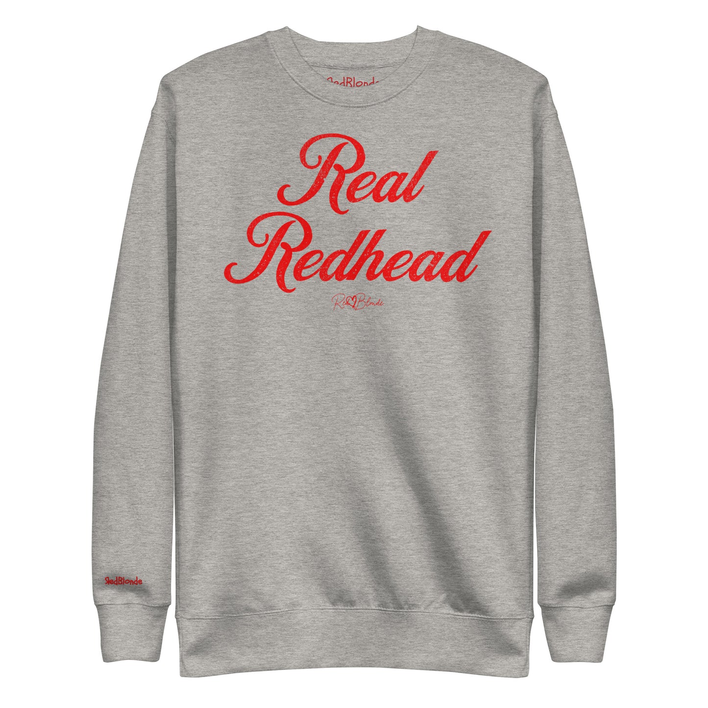 A classic grey relaxed fit unisex sweatshirt with the words 'Real Redhead' written in red vintage milkstore font, like coco cola script. Branded RedBlonde London in red on inside neck and right sleeve