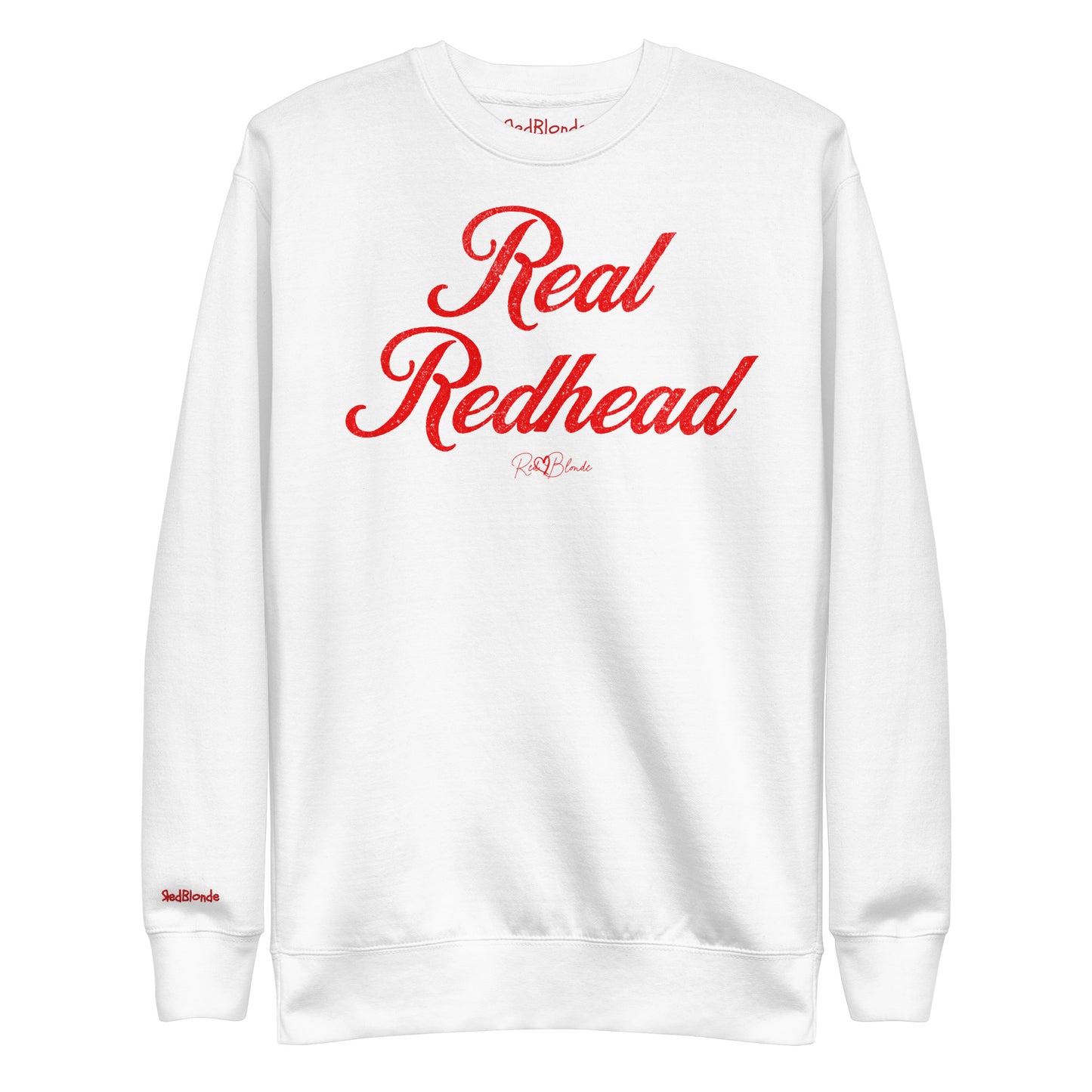 A classic white relaxed fit unisex sweatshirt with the words 'Real Redhead' written in red vintage milkstore font, like coco cola script. Branded RedBlonde London in red on inside neck and right sleeve