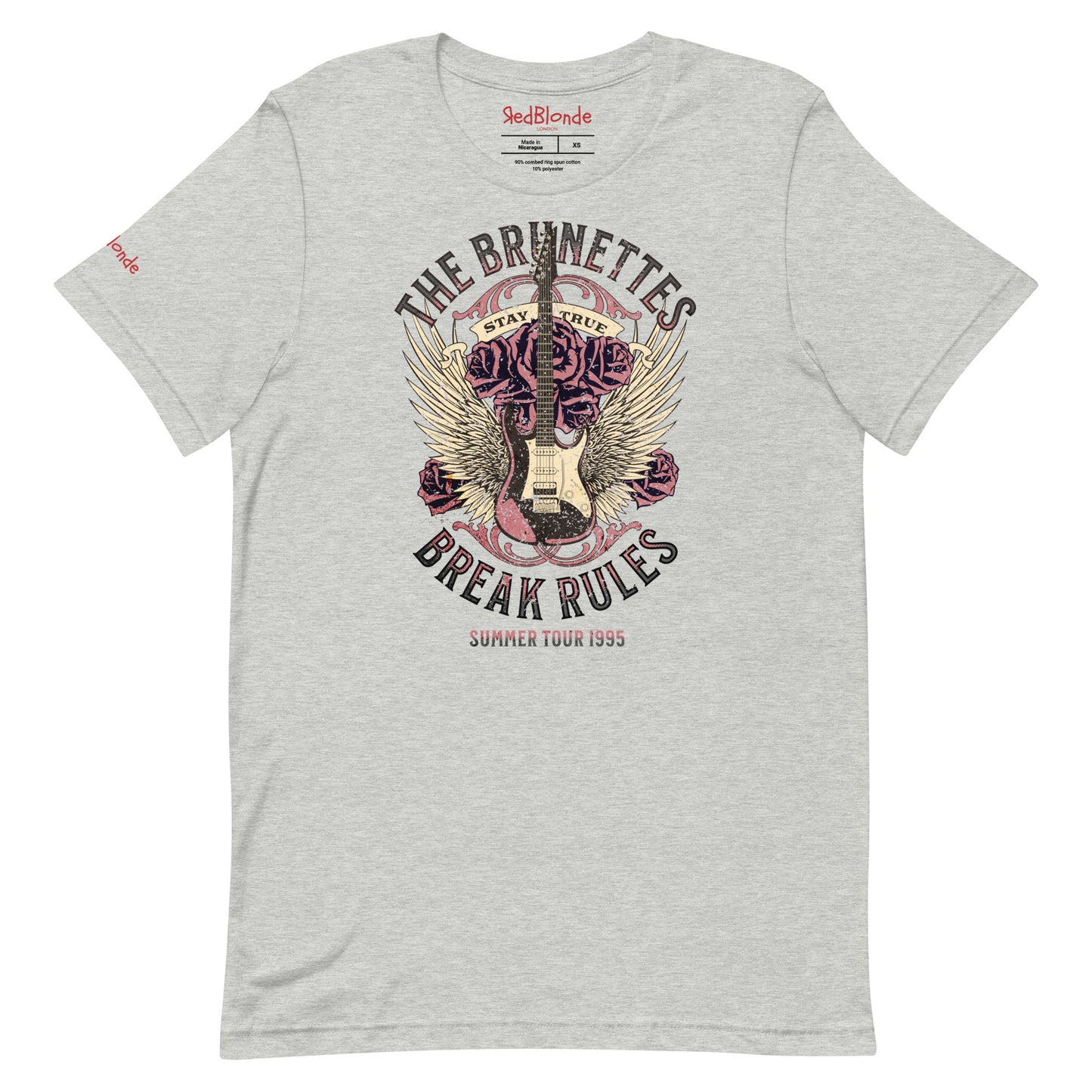 A grey unisex t-shirt with a burnt pink & beige graphic of a guitar with bird wings emerging from the side. The graphic features ‘THE BRUNETTES’ in Brookfield font above the guitar, ‘STAY TRUE' across the top and 'BREAK THE RULES’ underneath. Branded RedBlonde London in inside neck and right sleeve.