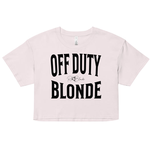 An orchid women's crop top with the words 'OFF DUTY BLONDE' written in large Brookfield black font, across the chest. signed RedBlonde in handwritten script inbetween off duty and blonde.