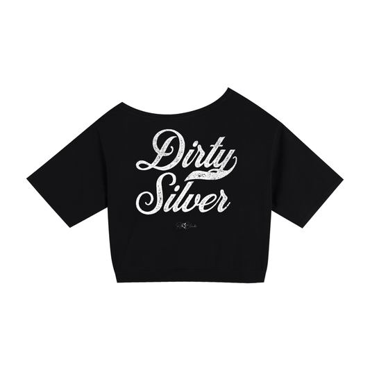 Back view of a black asymmetric off-the-shoulder waist length t-shirt featuring the bold white distressed Milkstore font “Dirty Silver” with the RedBlonde logo printed below. The relaxed, oversized fit and one-shoulder neckline give it a modern, effortless look.