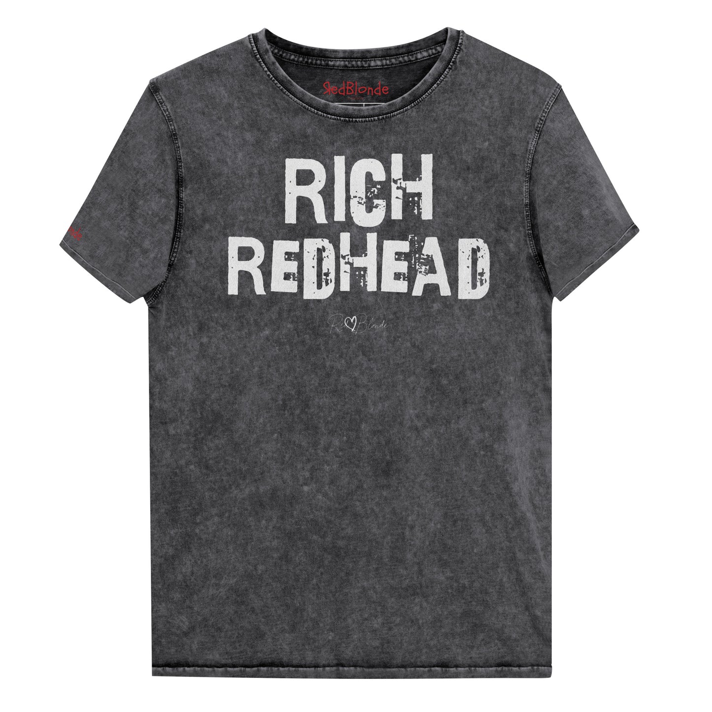 a black acid-wash unisex denim T-shirt with a distressed vintage look. The shirt features the bold white text “RICH REDHEAD” in a weathered Ed Gein font, and features the RedBlonde signature logo. The shirt has short sleeves, a crew neckline, and visible seam detailing for a rugged, casual style. Branded Redblonde on inside neck and right sleeve