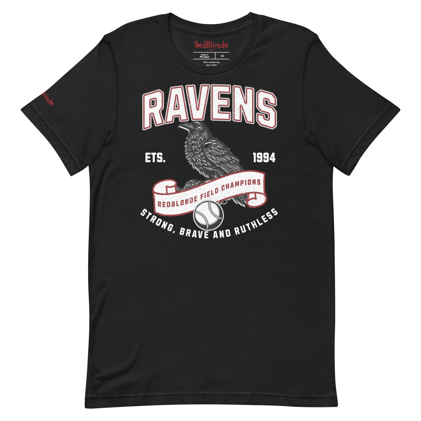 Black unisex t-shirt featuring a bold american collegiate vintage-style graphic with the word "RAVENS" in distressed red outlined white lettering. Below, a detailed black raven illustration perches on a scroll that reads "REDBLONDE FIELD CHAMPIONS," with a baseball beneath it. Additional text includes "ETS. 1994" and the phrase "STRONG, BRAVE AND RUTHLESS" in red. RedBlonde branding appears on the inner neck label and left sleeve in red text.