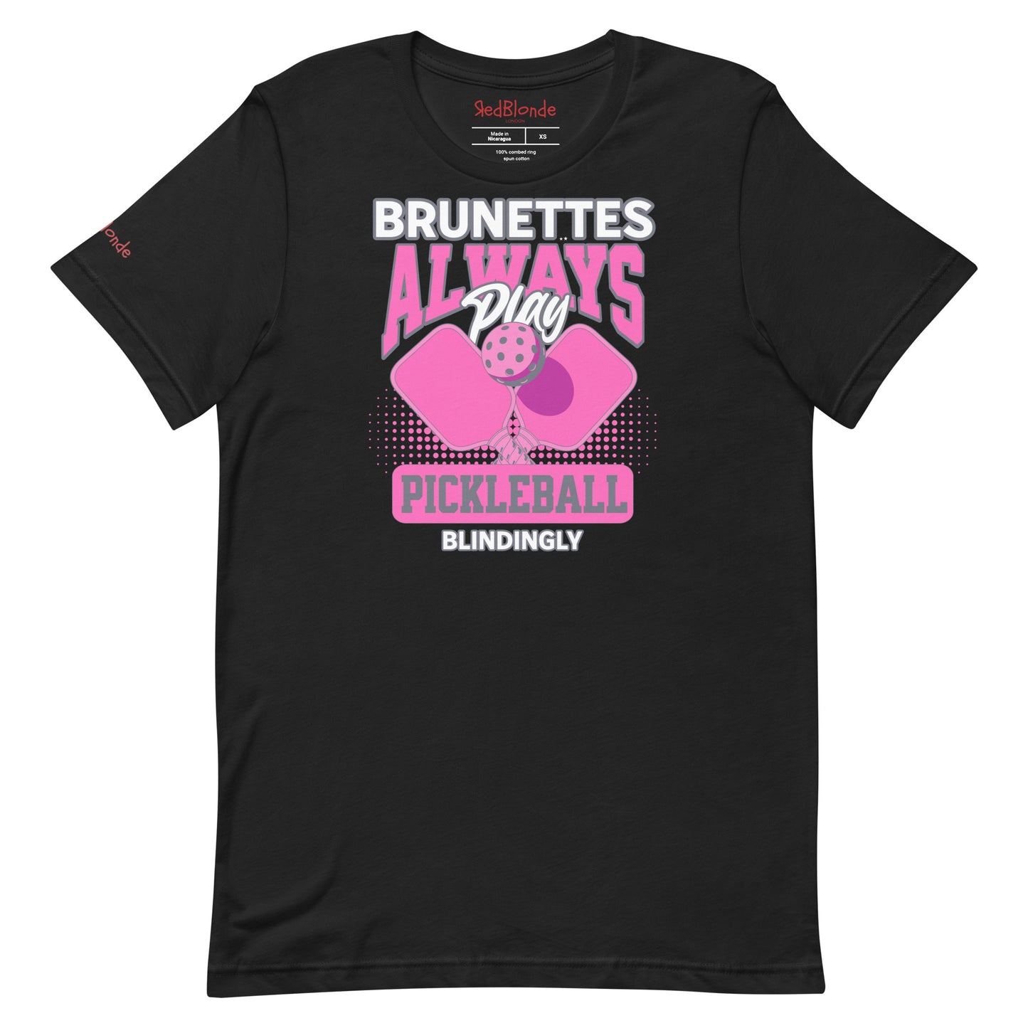 Black unisex t-shirt with bold pink and white graphic that says "Brunettes Always Play Pickleball Blindingly," featuring two pink pickleball paddles and a ball. Branded RedBlonde on inside neck and right sleeve