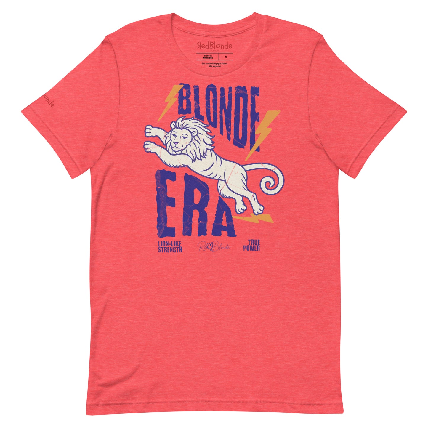 Red unisex short-sleeve t-shirt featuring a bold graphic of a leaping lion outlined in purple, surrounded by orange lightning bolts. The text “BLONDE ERA” appears in large distressed purple letters, with smaller text reading “LION-LIKE STRENGTH” and “TRUE POWER” underneath. Signed RedBlonde. The brand name “RedBlonde” is printed in red on the inside collar label and on the right sleeve near the cuff.
