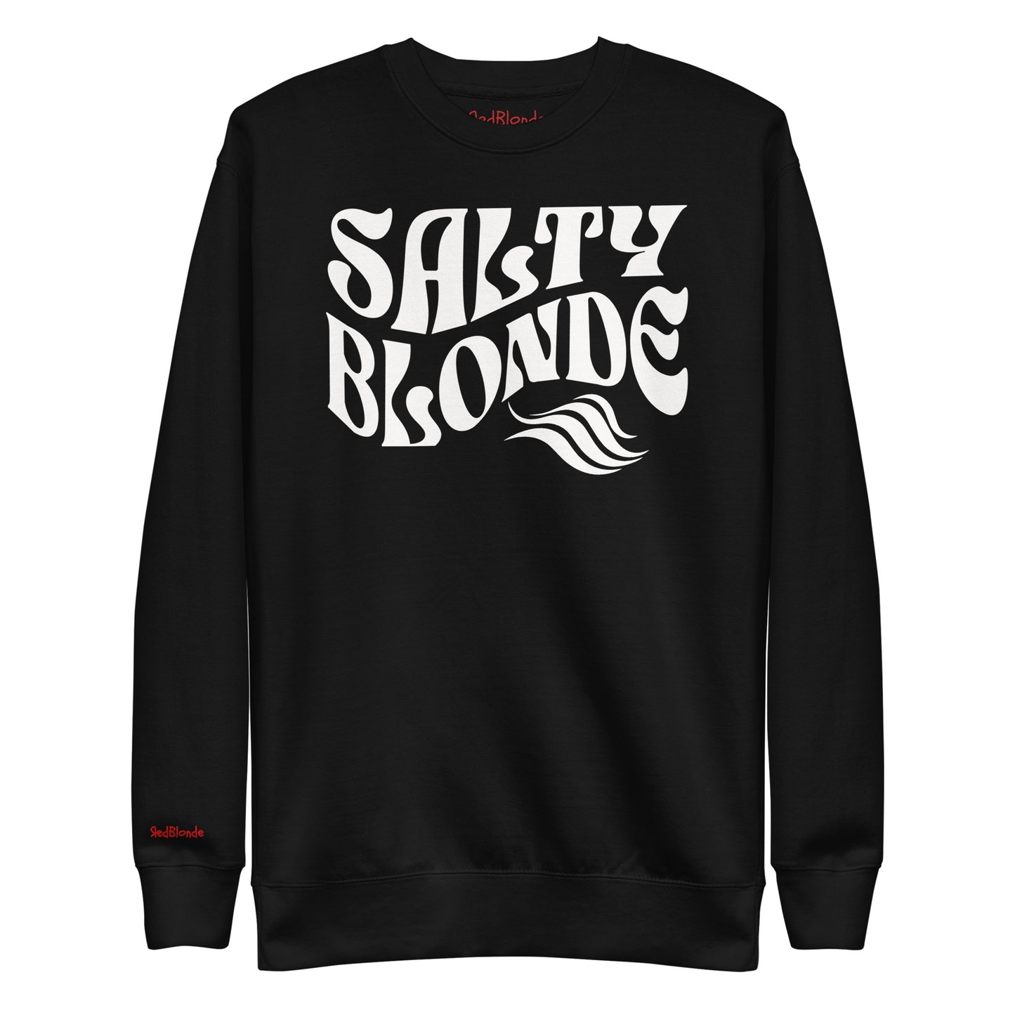 flatlay of Classic relaxed fit unisex sweatshirt in black with 'Salty Blonde' play on words slogan in white retro 70s wavy text. Branded RedBlonde on inside neck and right cuff in red