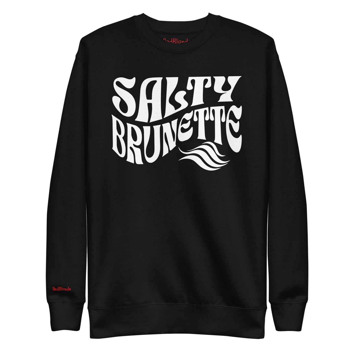 flatlay of Classic relaxed fit unisex sweatshirt in black with 'Salty Brunette' play on words slogan in white retro 70s wavy text. Branded RedBlonde London in red on inside neck and right cuff