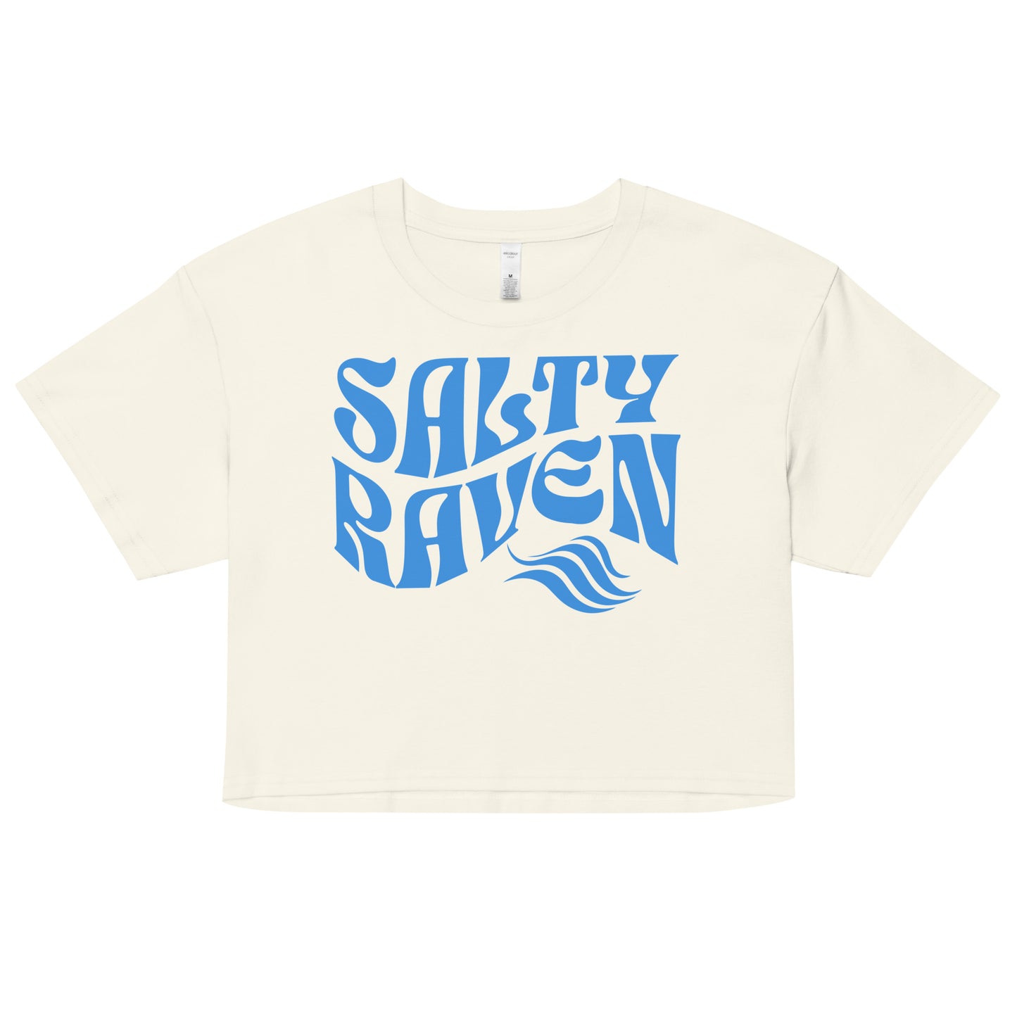Flatlay of a ecru loose crop top t-shirt with the words ‘Salty Raven’ in blue retro 70s wavy font