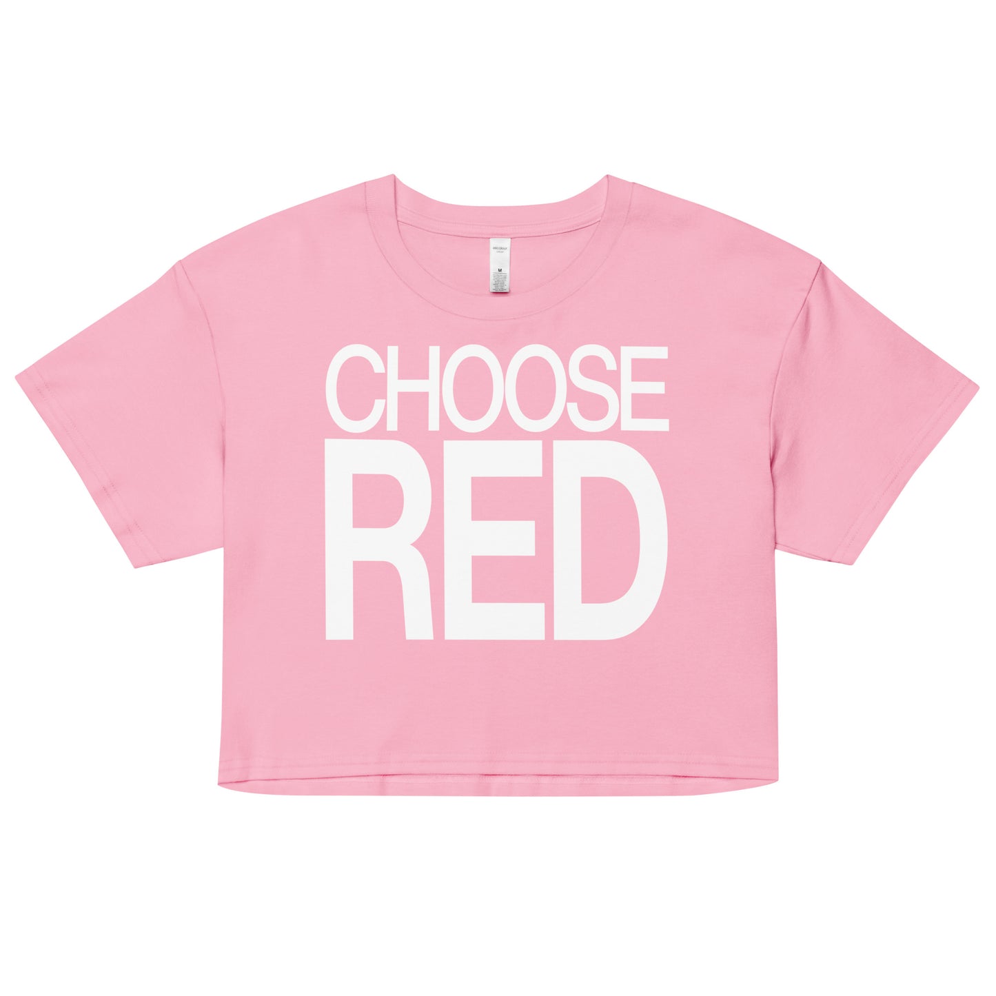 Flatlay of a pink women's crop top graphic t-shirt with “CHOOSE RED” in white Helvetica Now font emblazoned on the front.