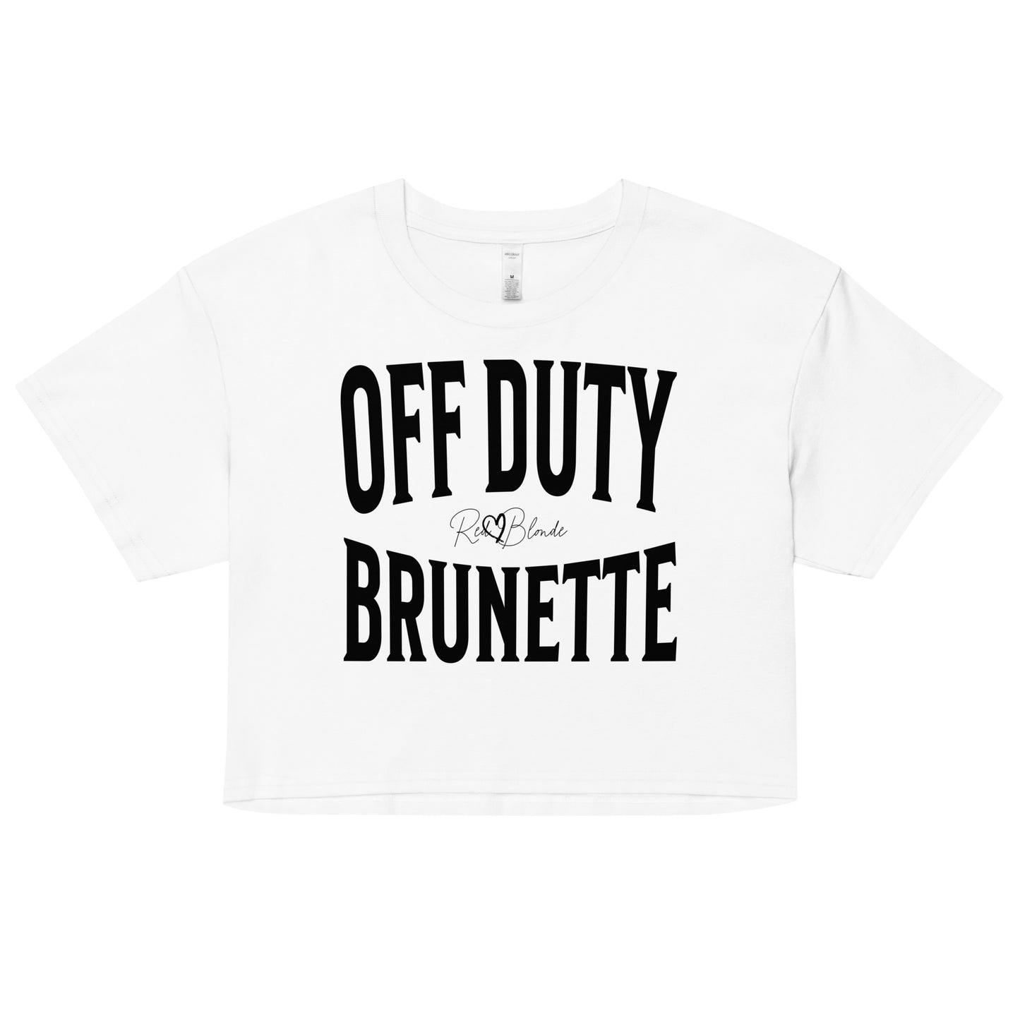 Flatlay of a white women's crop top graphic t-shirt with “OFF DUTY BRUNETTE” in black Helvetica Now font emblazoned on the front, signed off RedBlonde