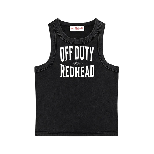 A black sleeveless vintage acid wash tank top laid flat on a white background, with white text on the chest reading “OFF DUTY REDHEAD” in bold Brookfield lettering, and a small cursive RedBlonde signature logo between the words.