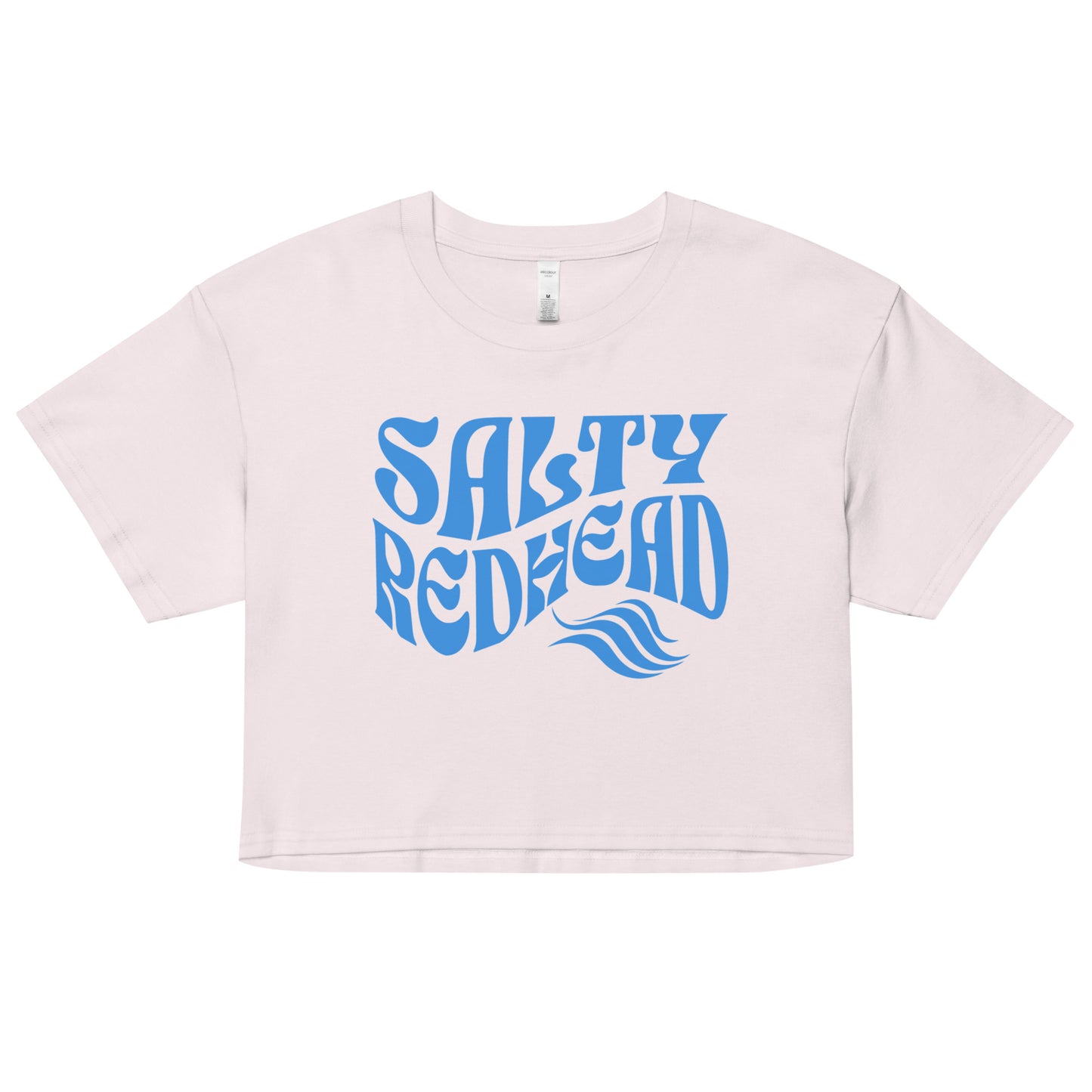 Flatlay of a orchid-white loose women's crop top t-shirt with the words ‘Salty Redhead’ in retro 70s text in blue. branded redblonde on inside neck and right shoulder