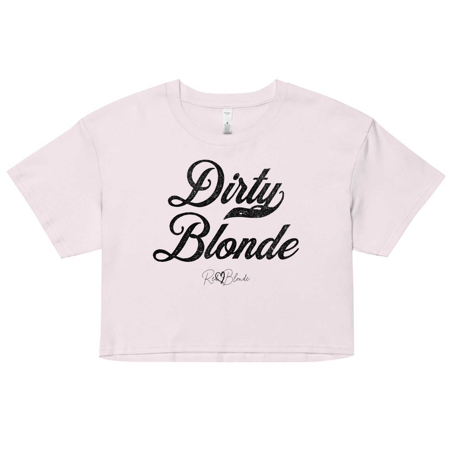 Orchid women’s crop top featuring the phrase “Dirty Blonde” in bold, black milkstore vintage-style script across the chest. Below the phrase, the brand name “RedBlonde” is printed in a smaller, elegant handwritten font.