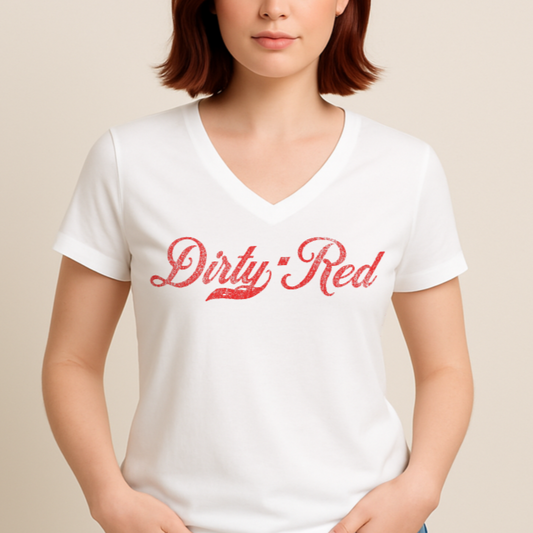 Redhead wears a white relaxed fit V-neck t-shirt with “Dirty Red” written in vintage Coca-Cola red milkstore script on the front. Branded RedBlonde on inside neck and right shoulder in red
