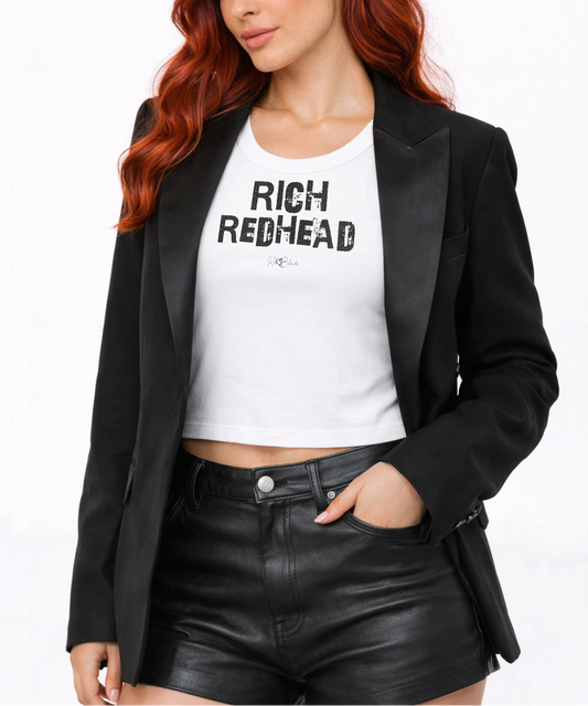 Redhead wears a white acid-wash vintage tank top with bold white Ed Gein font “RICH REDHEAD" slogan on the front and RedBlonde logo beneath.