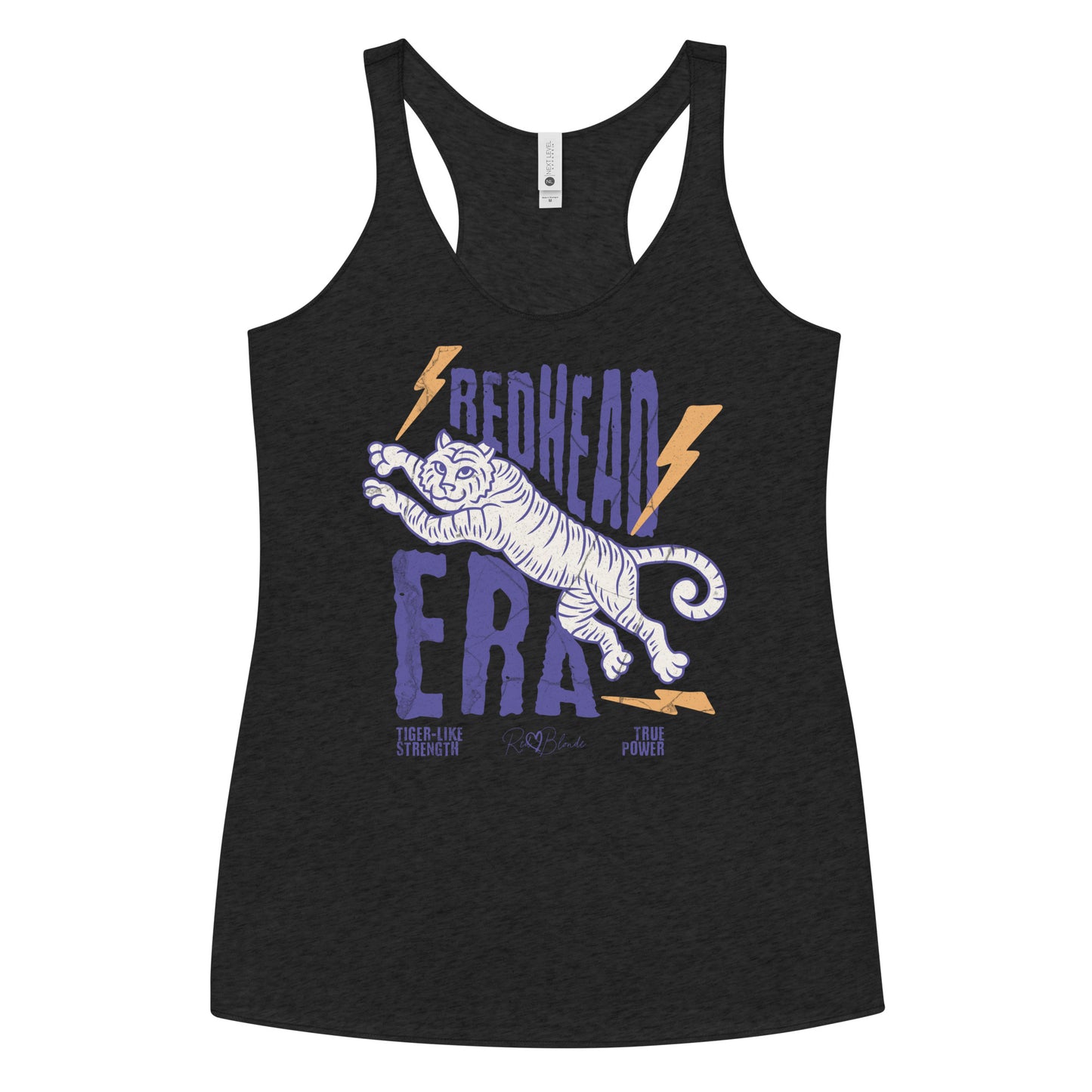 Women’s vintage-style racerback tank in heathered black features a large, stylized illustration of a tiger leaping forward in pale purple and white. Bold, distressed text above and below reads “REDHEAD ERA” in uppercase purple letters, with two orange lightning bolts flanking the text. Beneath the lion in small purple letters are the phrases “Tiger-like strength” and “True power.” RedBlonde with a heart small signature-like logo appears below the text.