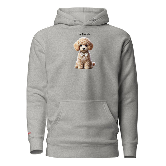 Flatlay of carbon grey relaxed fit unisex hoodie with a cute graphic of a Blonde Puppy wearing a bow-tie and the words 'the Blonde' linking to Blonde hair. Branded RedBlonde in red on inside neck and right cuff