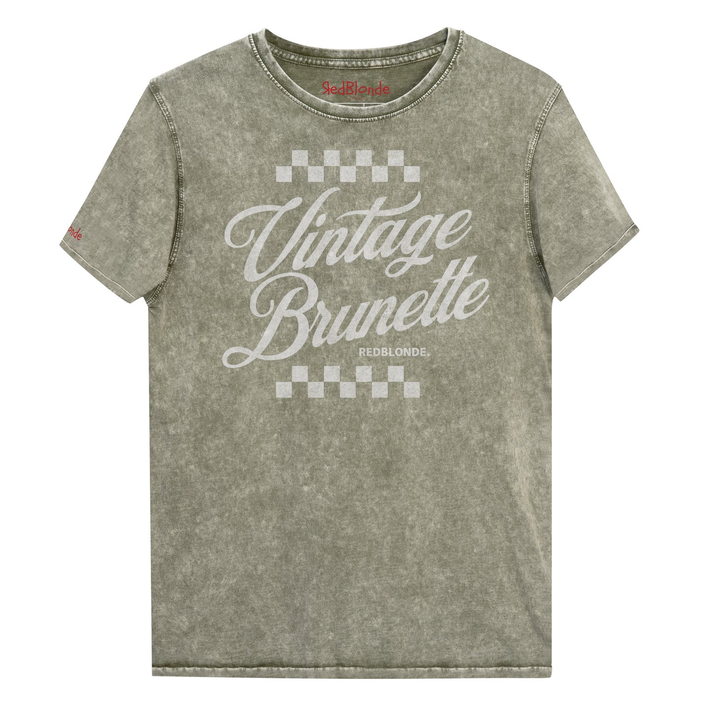 army green acid wash short-sleeve T-shirt featuring the bold white Milkstore 1 script text “Vintage Brunette” across the chest with checkerboard accents above and below the lettering. The brand name “RedBlonde.” is printed in small capital letters beneath the word “Brunette.” The shirt has a casual, slightly distressed look with visible stitching along the seams. Branded RedBlonde on inside collar and right sleeve