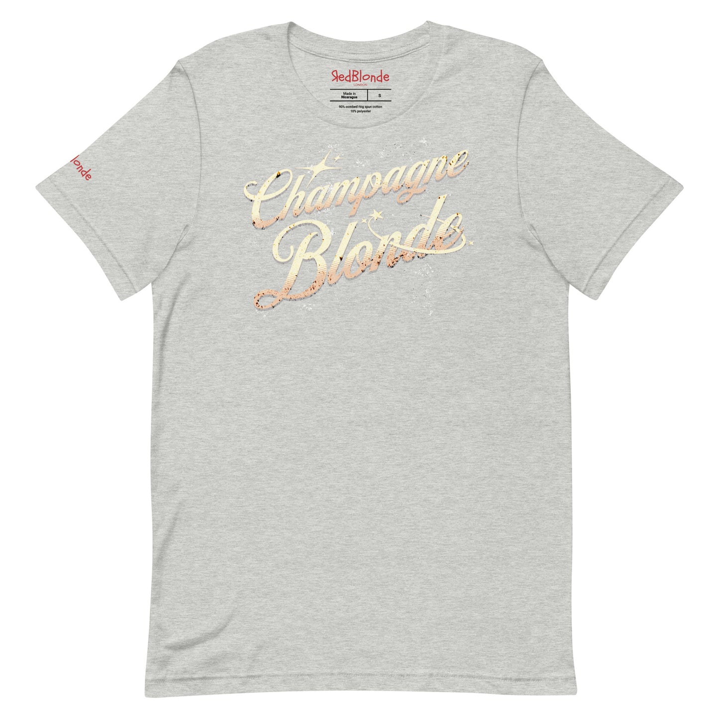 Flatlay of athletic gray unisex relaxed fit t-shirt with 'Champagne Blonde' on an angle in Milkstore 01 font in a golden hue with a sprinkle of distressed stars. Branded RedBlonde London in red on inside neck and right sleeve.