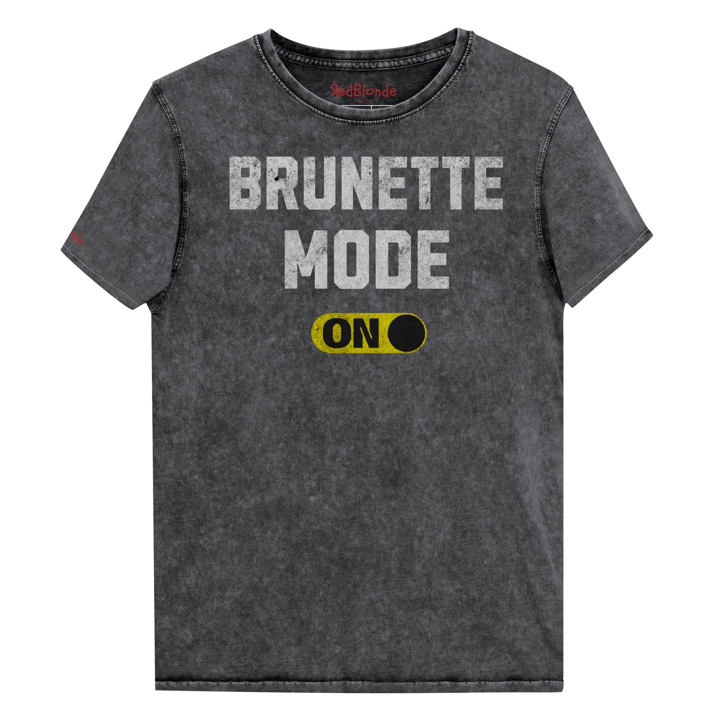 Black denim-style unisex t-shirt with bold distressed white Univercity font reading “Brunette Mode” and a yellow on/off switch graphic in the “On” position beneath. The design includes subtle worn texture for a vintage look. Branded RedBlonde London in red on inside neck and right sleeve
