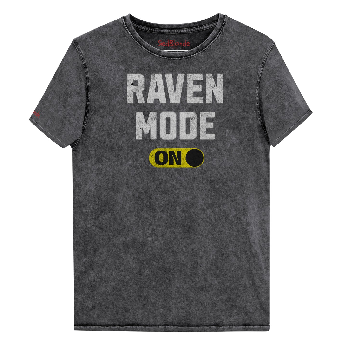 black denim-style unisex t-shirt with bold distressed white Univercity font reading “Raven Mode” and a yellow on/off switch graphic in the “On” position beneath. The design includes subtle worn texture for a vintage look. Branded RedBlonde London in red on inside neck and right sleeve