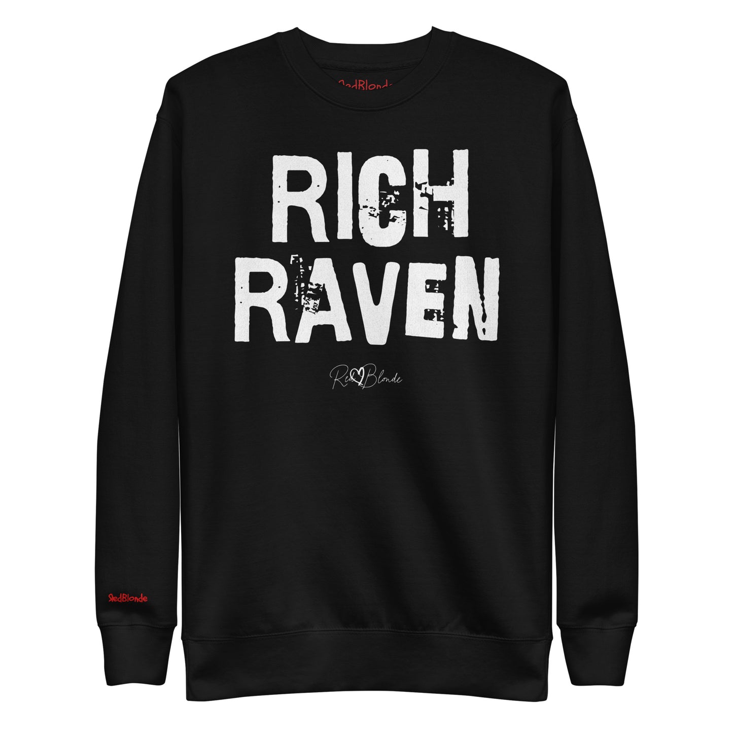 Black unisex premium sweatshirt with bold distressed white Ed Geinitext “RICH RAVEN” on the front, featuring a subtle RedBlonde logo beneath the lettering and on the sleeve cuff and inside neck