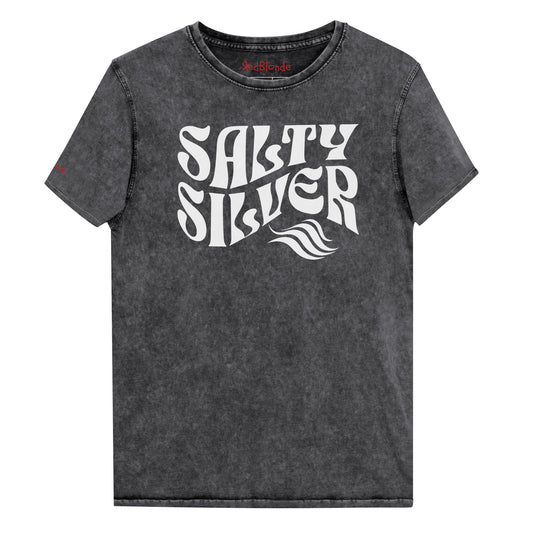 flatlay of black denim vintage wash graphic t-shirt with the slogan 'Salty Silver' in white retro 70s wavy font. Branded RedBlonde inside neck and right shoulder in red