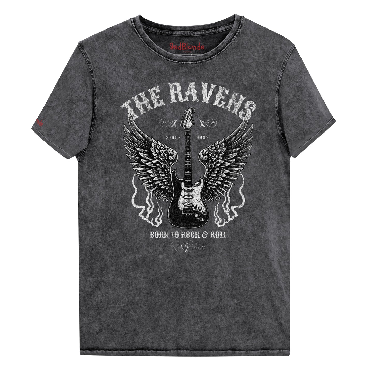 A flatlay of a black denim wash unisex t-shirt with a graphic of a black & white guitar with raven bird wings emerging from the side. The graphic features ‘THE RAVENS’ in Sancreek font in a semicircle above the guitar, while ‘BORN TO ROCK & ROLL’ is underneath. Branded RedBlonde London in inside neck and right sleeve