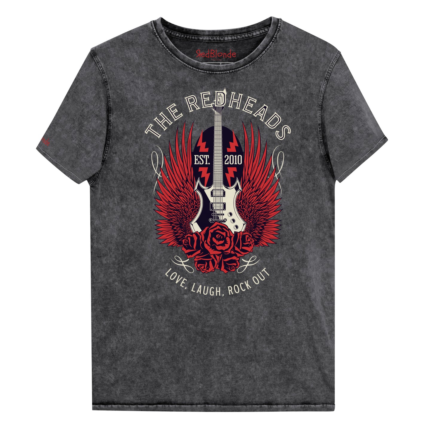 A flatlay of a black denim wash unisex t-shirt with a graphic of a black & white guitar with red bird wings emerging from the side. The graphic features ‘THE REDHEADS' in Brookfield font in a semicircle above the guitar, while ‘Love, laugh, rock out’ is underneath. Branded RedBlonde London in inside neck and right sleeve