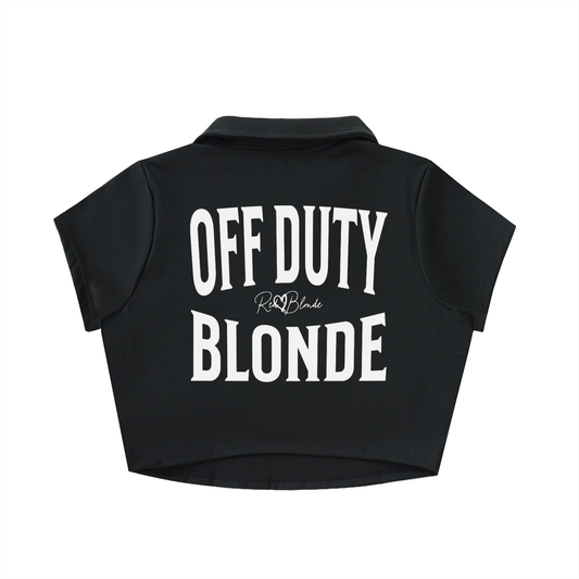 Black cropped polo shirt with large white “OFF DUTY BLONDE” Brookfield text on the back and a small RedBlonde script logo beneath.