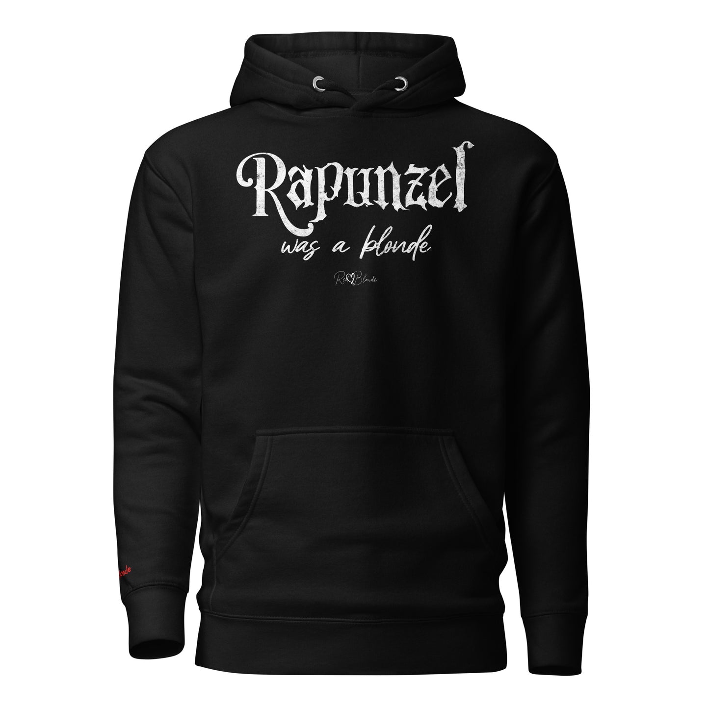 black unisex pullover hoodie with kangaroo pocket and adjustable drawstrings. The front features distressed white lettering that reads “Rapunzel was a blonde” in a mix of gothic and script fonts, with the RedBlonde signature logo beneath. Branded RedBlonde on inside neck and right sleeve