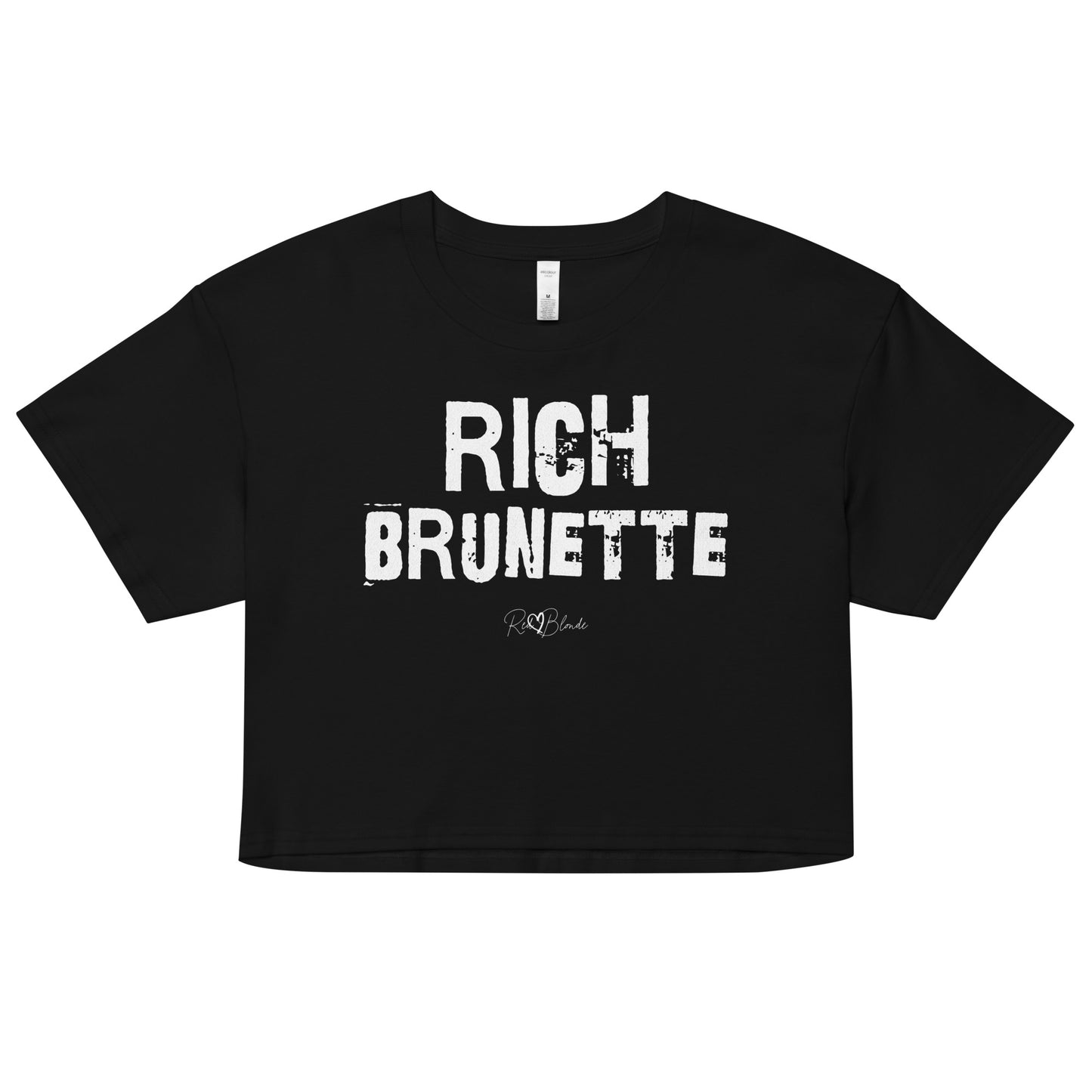 black crop top with a relaxed fit, short sleeves, and a wide crew neckline. The front features bold white distressed Ed Gein lettering reading “RICH BRUNETTE” with the RedBlonde signature logo underneath in white