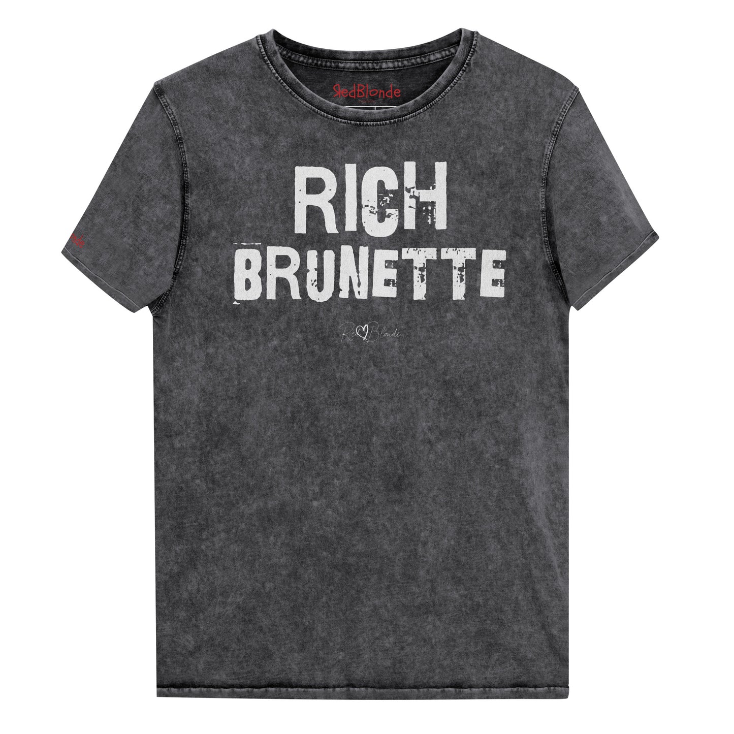 a black acid-wash unisex denim T-shirt with a distressed vintage look. The shirt features the bold white text “RICH BRUNETTE” in a weathered Ed Gein font, and features the RedBlonde signature logo. The shirt has short sleeves, a crew neckline, and visible seam detailing for a rugged, casual style. Branded Redblonde on inside neck and right sleeve