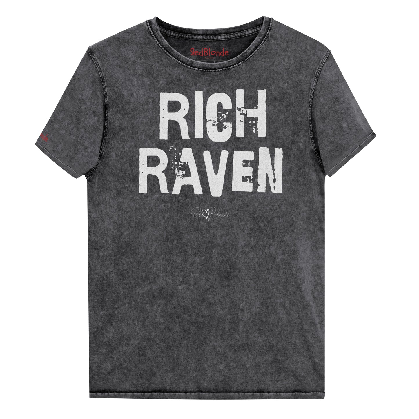 a black acid-wash unisex denim T-shirt with a distressed vintage look. The shirt features the bold white text “RICH RAVEN” in a weathered Ed Gein font, and features the RedBlonde signature logo. The shirt has short sleeves, a crew neckline, and visible seam detailing for a rugged, casual style. Branded Redblonde on inside neck and right sleeve