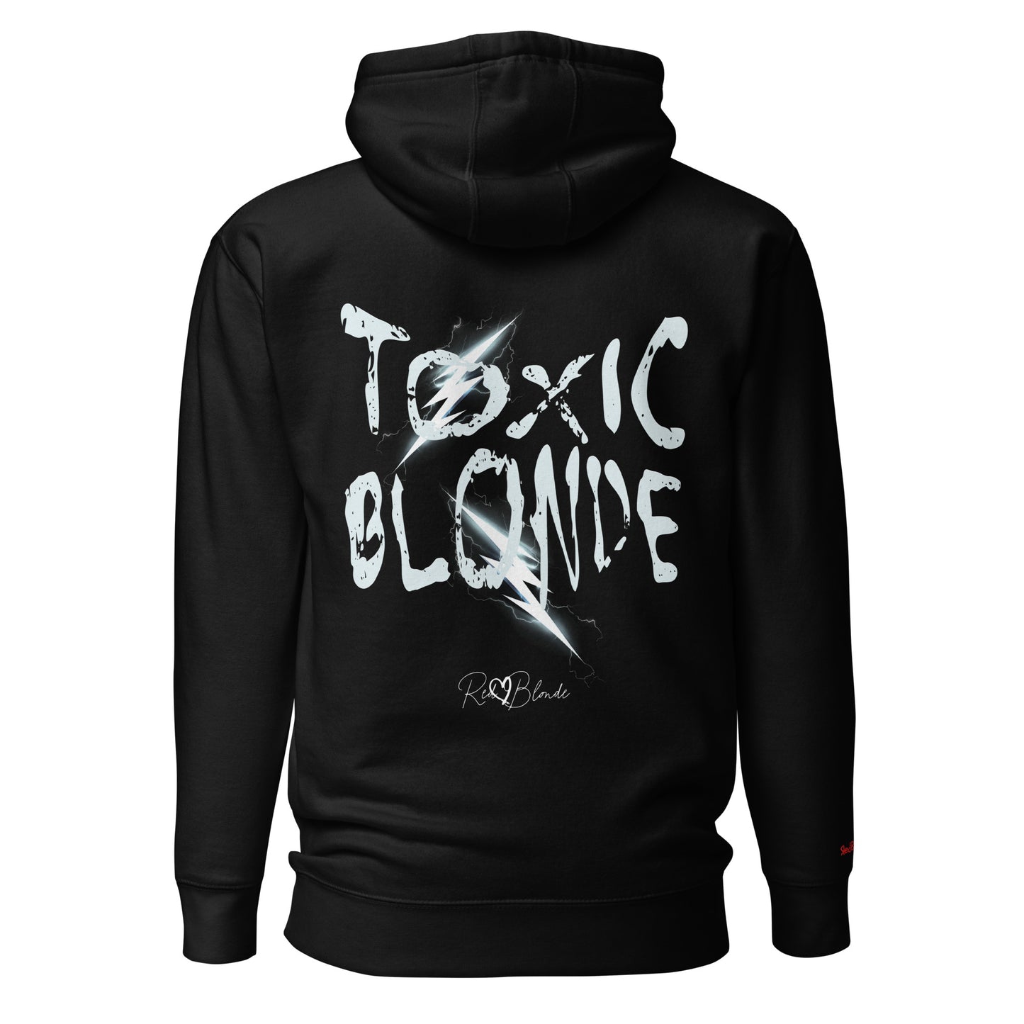 Back view of a black unisex hoodie featuring bold distressed white Chainsaw Carnage text reading “Toxic Blonde” with lightning-style accents and the RedBlonde signature logo underneath. The design has an edgy, electric aesthetic.Branded RedBlonde in red on right sleeve