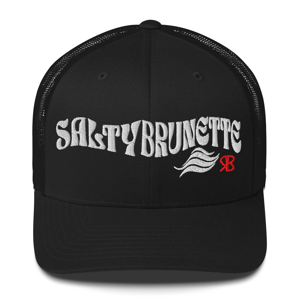 black trucker cap with 'Salty Brunette' in white Solino display font. Branded RB in red