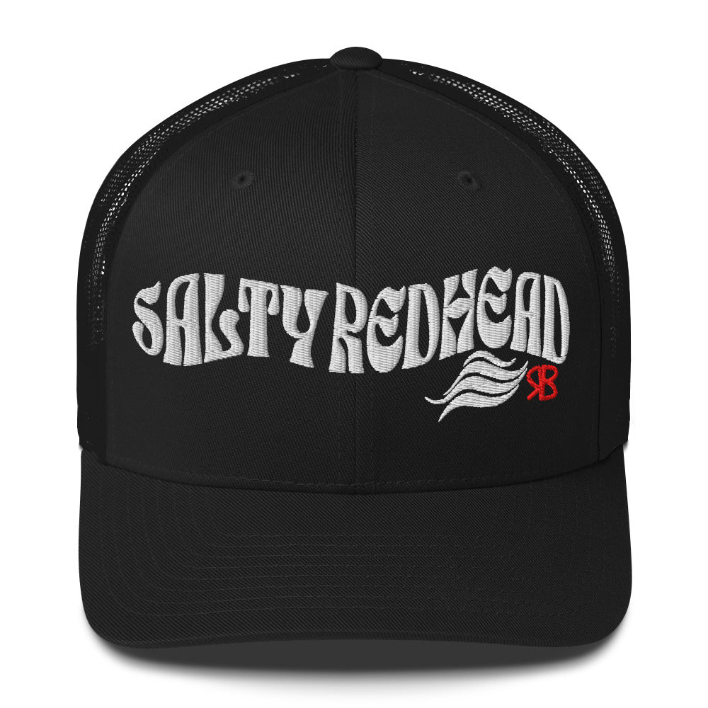 black trucker cap with 'Salty Redhead' in white Solino display font. Branded RB in red