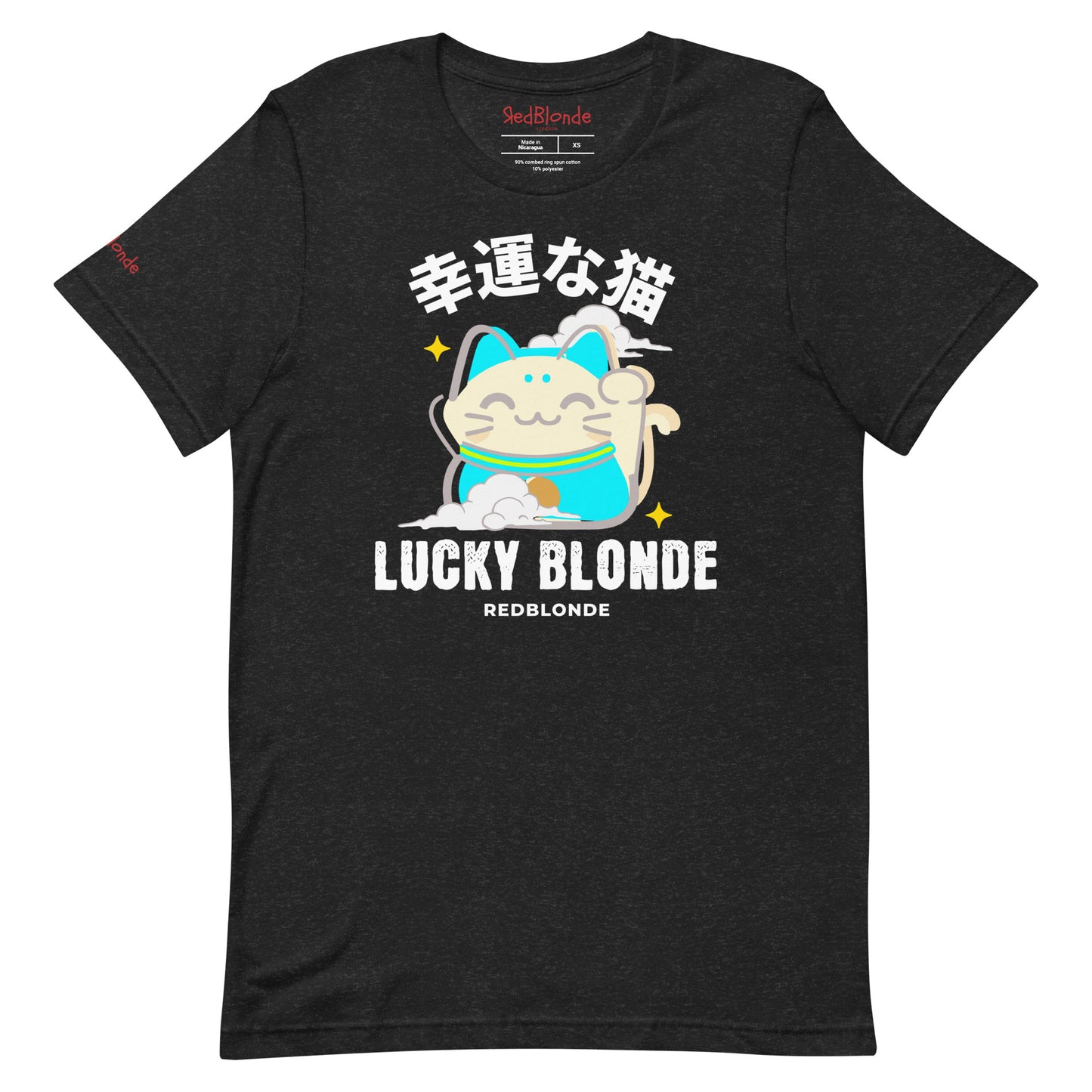 A black unisex T-shirt featuring a cheerful maneki-neko (lucky cat) graphic in cream, turquoise, and black, with golden star accents. Above the cat are Japanese characters meaning “Lucky Cat.” Below the design, the text reads “LUCKY BLONDE” in bold black letters and “REDBLONDE” in smaller font. The T-shirt has a classic crew neckline and short sleeves. Branded RedBlonde on the inside neck and right sleeve