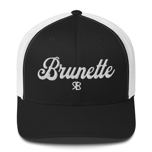 black/white trucker cap with 'Brunette' in white adventurer 01 font on front. Branded RB
