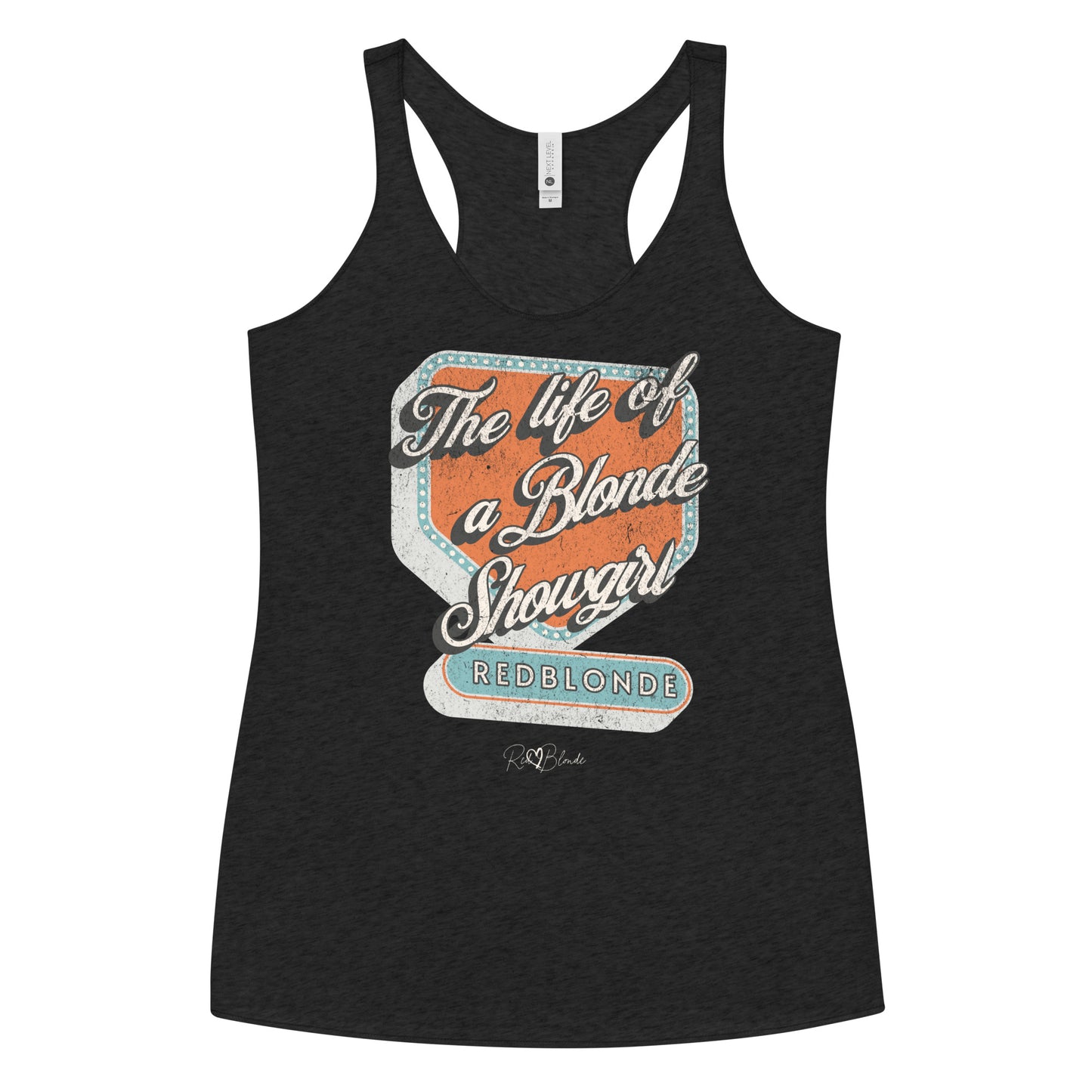 black racerback tank t-shirt with bold retro-style graphic text reading 'The life of a Blonde Showgirl' in white script over an orange and turquoise marquee design. The word 'RedBlonde' is displayed in turquoise block letters at the bottom, with subtle worn details giving the shirt a distressed, retro look."