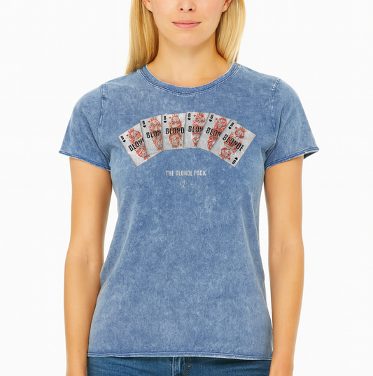 Blonde wears a Unisex blue acid denim wash tshirt featuring a bold graphic of Queen playing cards spread across the chest, each card with a famous blonde. Below the cards, the text reads “THE BLONDE PACK” with the RedBlonde signature logo.