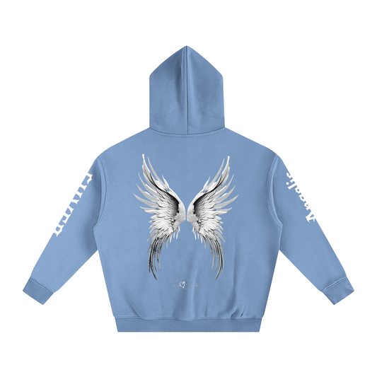 Back view of a blue hoodie featuring large silver angel wings printed across the back, with black RedBlonde signature logo underneath. Each sleeve features gothic New Rockstar font graphic text one sleeve says 'Angelic' and the other 'Silver'