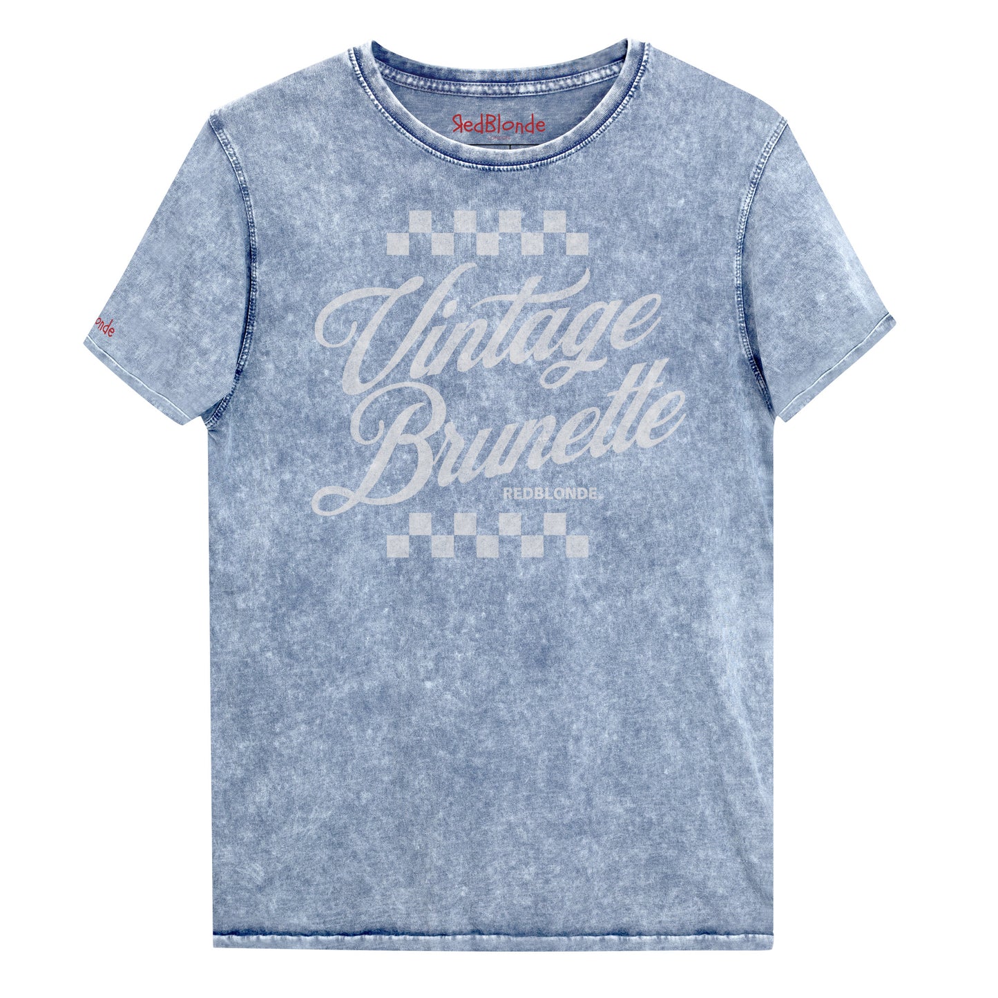 blue acid wash short-sleeve T-shirt featuring the bold white Milkstore 1 script text “Vintage Brunette” across the chest with checkerboard accents above and below the lettering. The brand name “RedBlonde.” is printed in small capital letters beneath the word “Brunette.” The shirt has a casual, slightly distressed look with visible stitching along the seams. Branded RedBlonde on inside collar and right sleeve