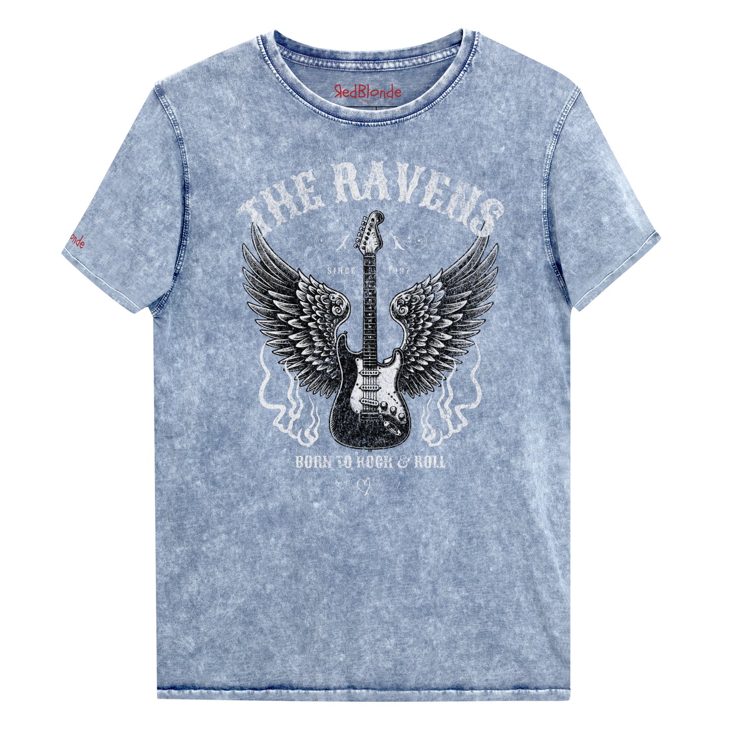 Flatlay of blue denim wash unisex t-shirt with a graphic of a black & white guitar with raven bird wings emerging from the side. The graphic features ‘THE RAVENS’ in Sancreek font in a semicircle above the guitar, while ‘BORN TO ROCK & ROLL’ is underneath. Branded RedBlonde London in inside neck and right sleeve
