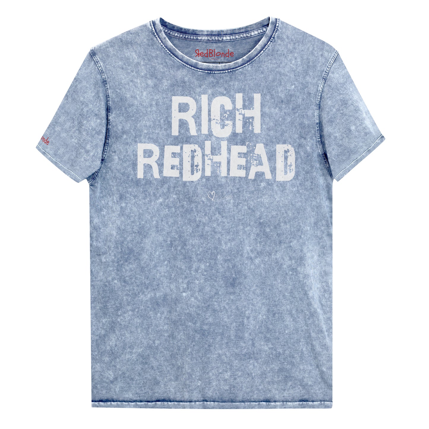 a blue acid-wash unisex denim T-shirt with a distressed vintage look. The shirt features the bold white text “RICH REDHEAD” in a weathered Ed Gein font, and features the RedBlonde signature logo. The shirt has short sleeves, a crew neckline, and visible seam detailing for a rugged, casual style. Branded Redblonde on inside neck and right sleeve