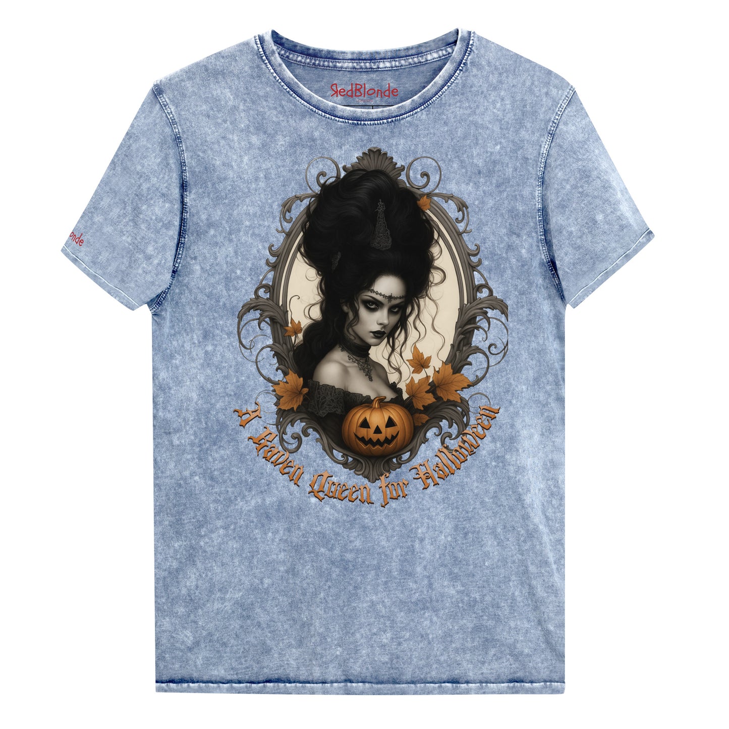 Blue acid-wash unisex T-shirt featuring a gothic-style illustration of a dark-haired woman with an elaborate beehive hairstyle, framed by ornate scrollwork, autumn leaves, and a carved pumpkin. The design is captioned with the text ‘A Raven Queen for Halloween’ in vintage Dark Angle lettering. Branded RedBlonde in red on inside neck and right sleeve