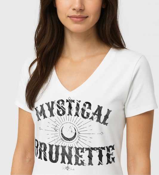 Brunette wears a women’s white v-neck t-shirt with bold Sancreek vintage-style black lettering that reads ‘Mystical Brunette’ with a crescent moon and radiant sunburst graphic. Branded RedBlonde in red on inside neck and right sleeve