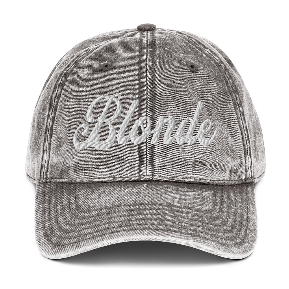 flatlay of charcoal grey denim vintage wash effect baseball cap with the word 'Blonde' embroidered on the front in white adventure font