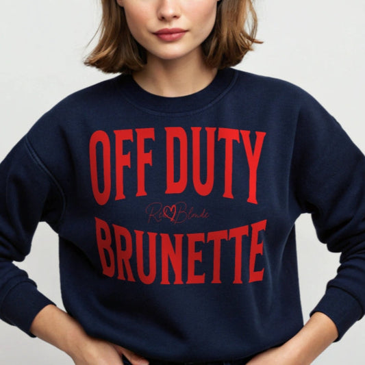 A classic navy blue relaxed fit unisex sweatshirt with the words 'OFF DUTY BRUNETTE' written in large Brookfield red font, across the front. Branded RedBlonde London in red on inside neck and right sleeve