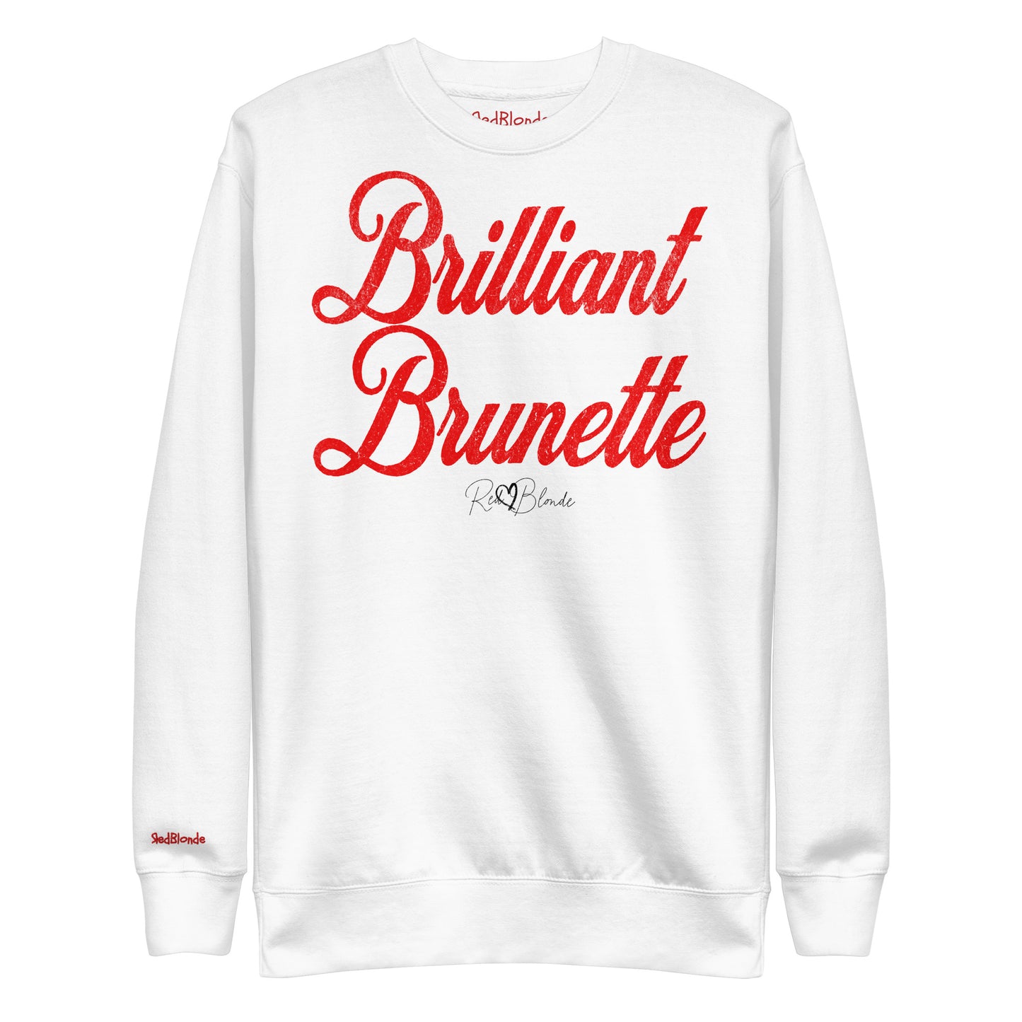 A classic white relaxed fit unisex sweatshirt with the words 'Brilliant Brunette' written in large red vintage milkstore font, like coco cola script. Branded RedBlonde London in red on inside neck and right sleeve